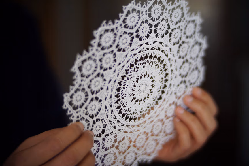 Hands holding a lace from Pag